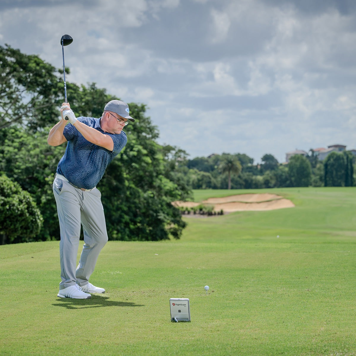 FlightScope Mevo Gen 2 launch monitor set up indoors for accurate golf swing and shot tracking