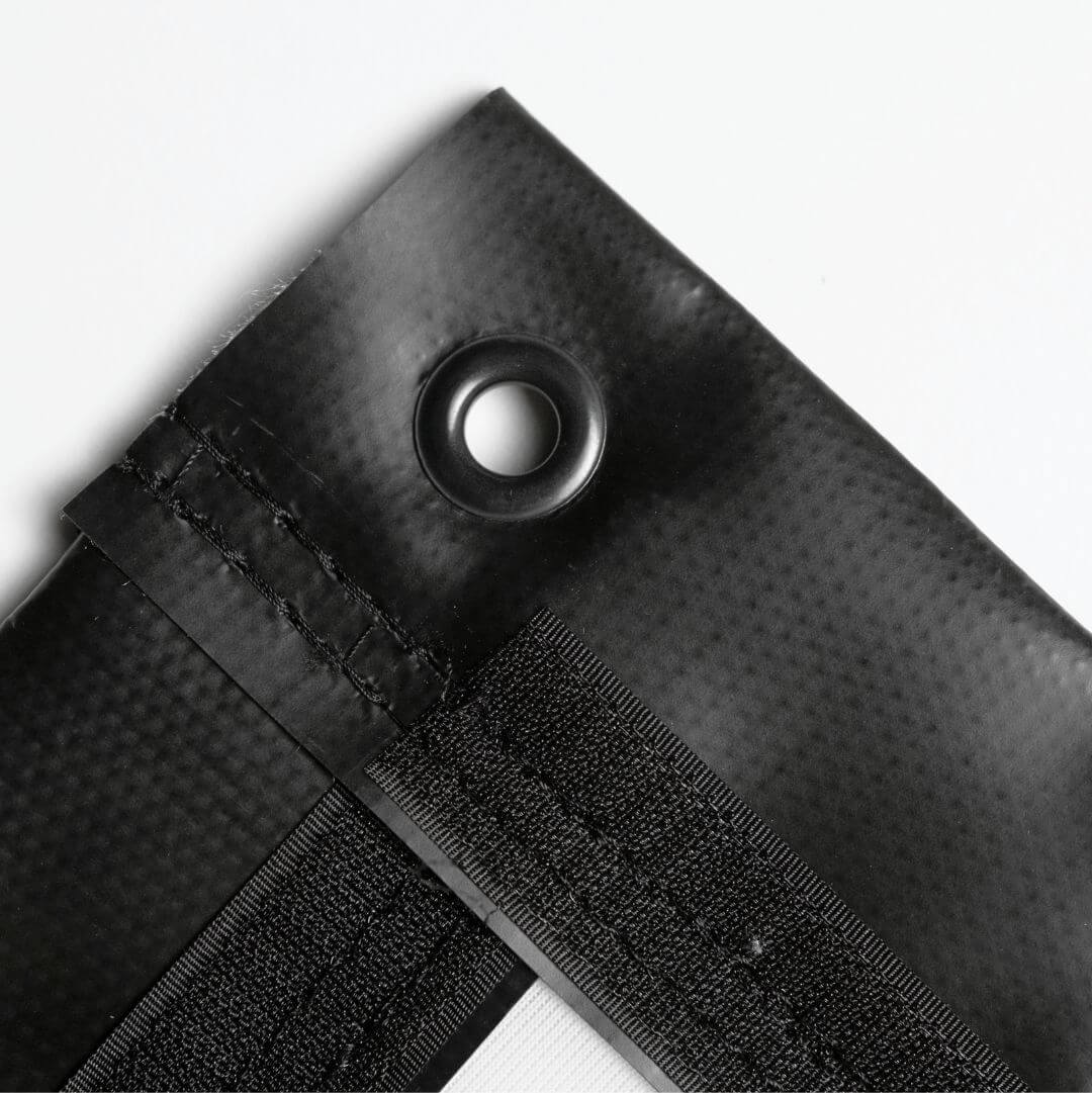 Premium golf simulator impact screen showing top grommet for secure mounting